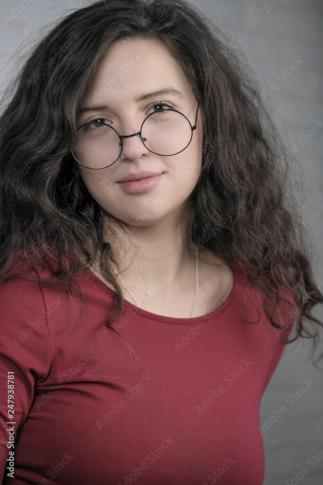 Fototapeta premium Beautiful attractive girl in a red dress