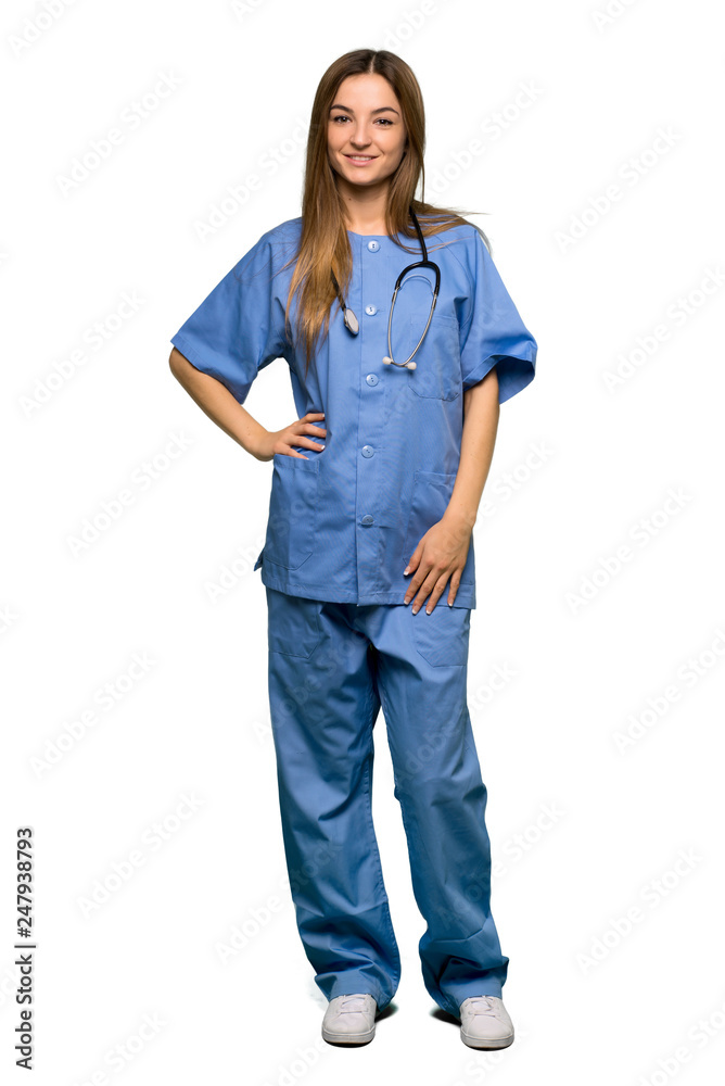 Full body Young nurse posing with arms at hip and smiling on isolated background Full body Young nurse posing with arms at hip and smiling on isolated background