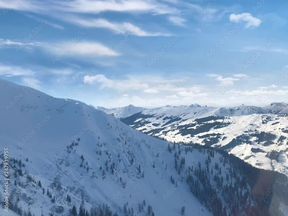 Mountain panorama of the Austrian ski resort of Saalbach-Hinterglemm , Austria with great cloudscape Mountain panorama of the Austrian ski resort of Saalbach-Hinterglemm , Austria with great cloudscape