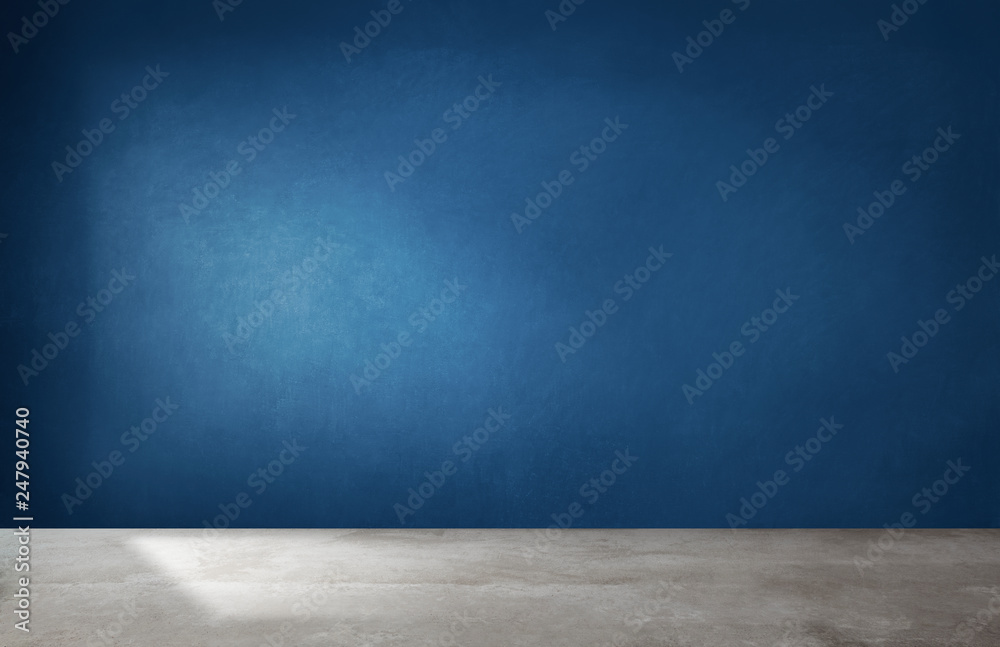 Dark blue wall in an empty room with a concrete floor - obrazy, fototapety, plakaty 