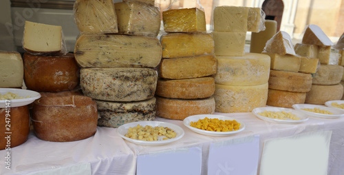 stall with aged cheeses such as pecorino in the alfresco market