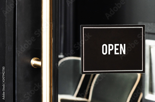 Open sign mockup on the door of a cafe