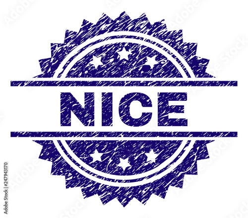 NICE stamp seal watermark with distress style. Blue vector rubber print of NICE tag with corroded texture.