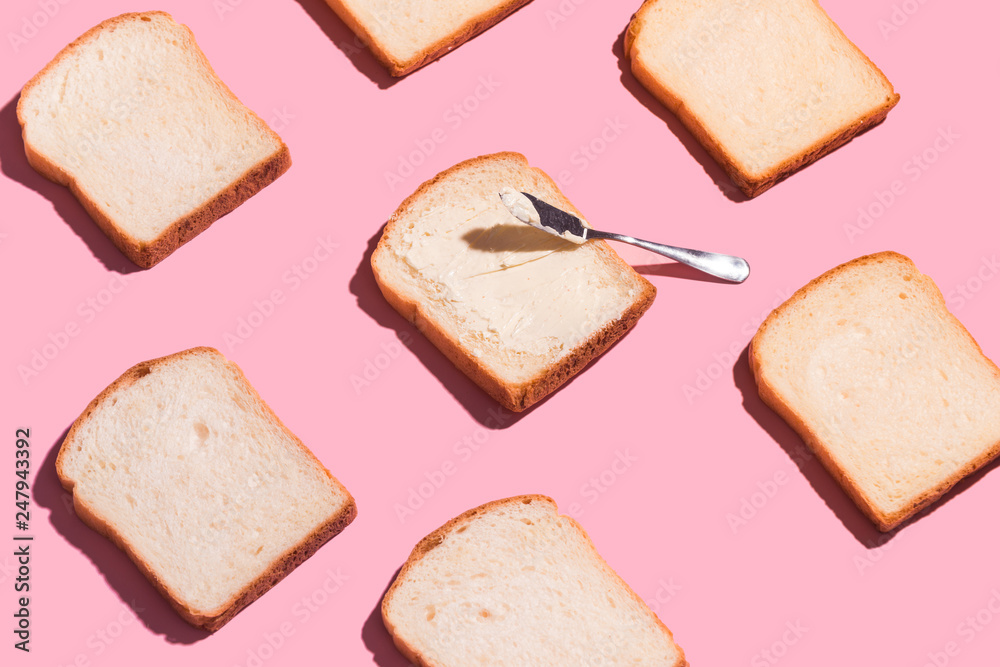 Sliced bread to toast isolated on pink background. Close up. Top view Sliced bread to toast isolated on pink background. Close up. Top view