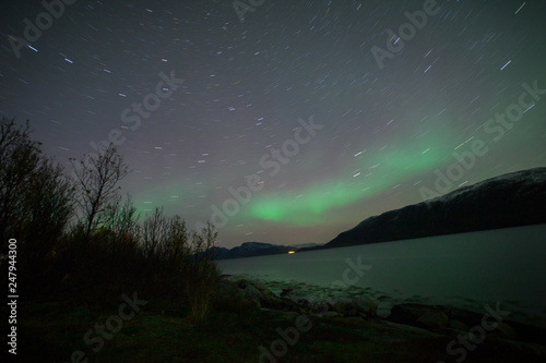northern lights in Norway with stars in long exposure