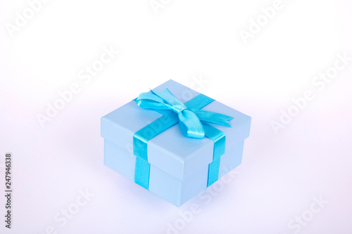 gift box with blue bow and white background