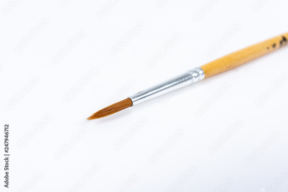 Painting brushes. Drawing tools, paint brushes on white background, copy space, top view Painting brushes. Drawing tools, paint brushes on white background, copy space, top view