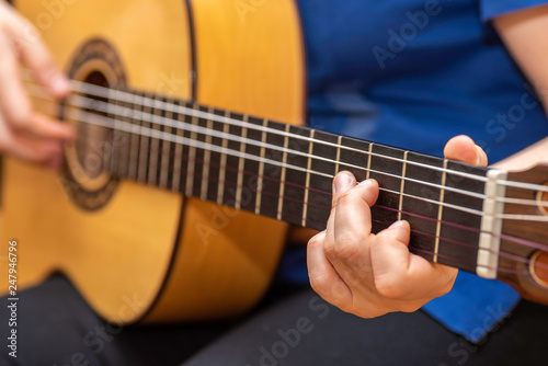 Playing guitar.