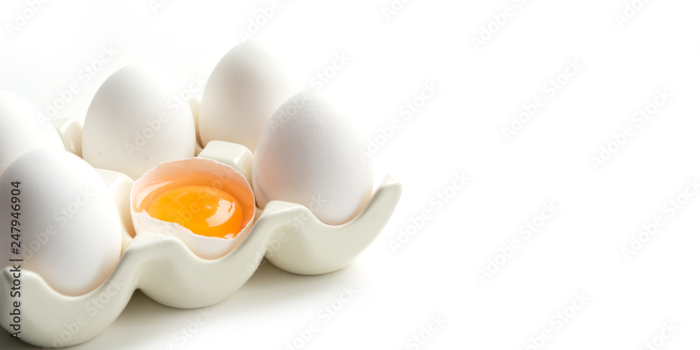 Organic white chicken eggs in porcelain decorative box. Close up with copy space. Organic white chicken eggs in porcelain decorative box. Close up with copy space.