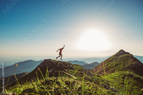 Man trail running on a mountain at the dask photo