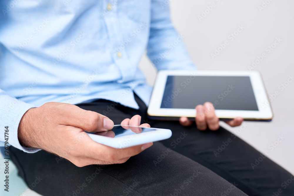 Businessman checking text messages Businessman checking text messages