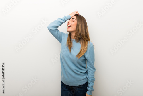 Blonde woman on isolated white background has just realized something and has intending the solution