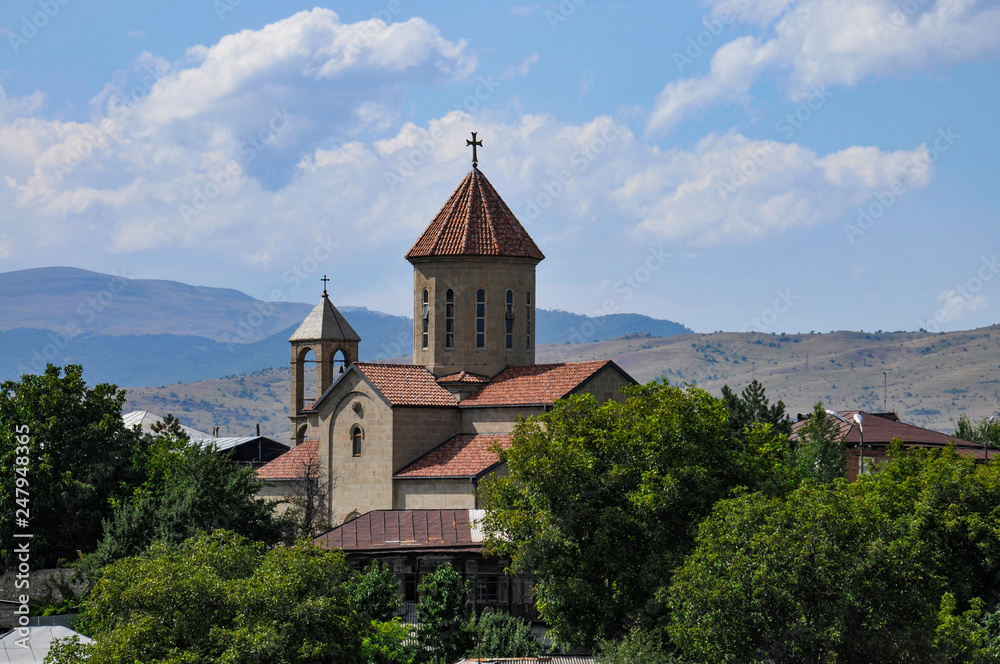Georgian church in the mountains Georgian church in the mountains