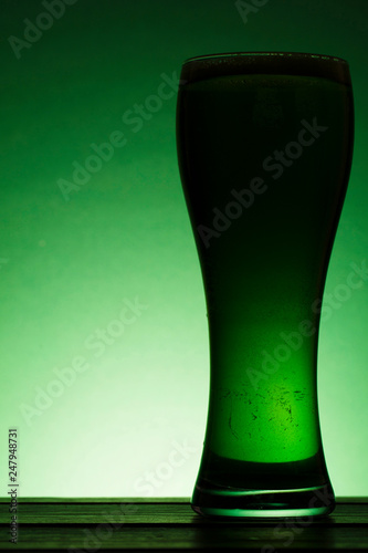 St Patrick's Day green beer silhouette against a green background