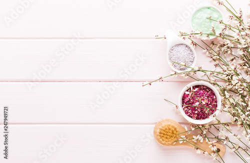 Beauty and fashion concept with spa set on pastel rustic wooden background.