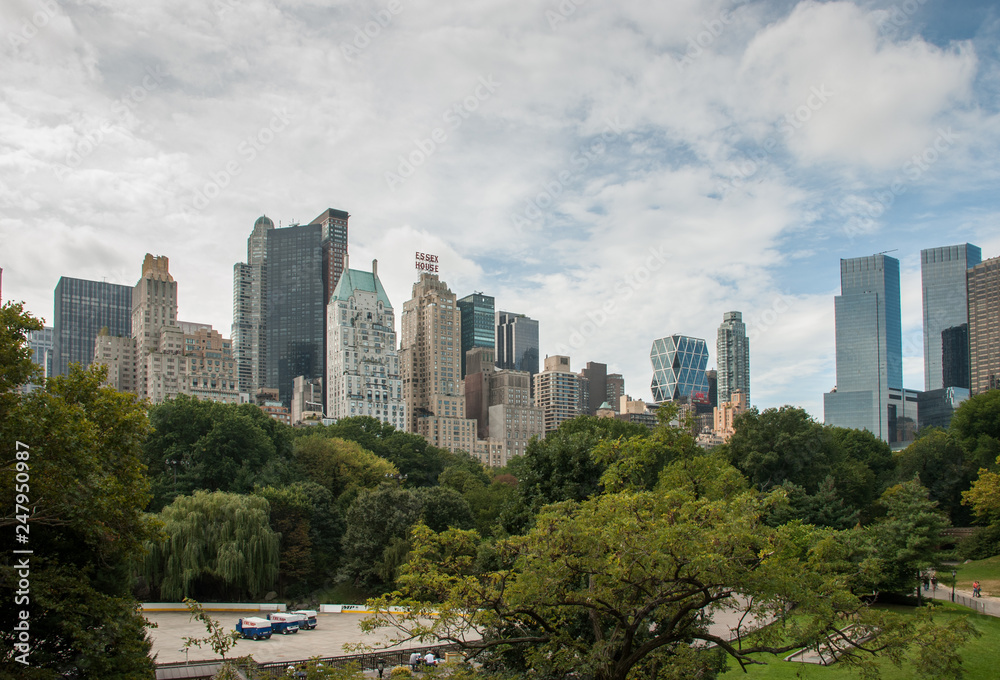 Panoramic view from Central Park to Manhattan skyscrapers at sunny day. New York City