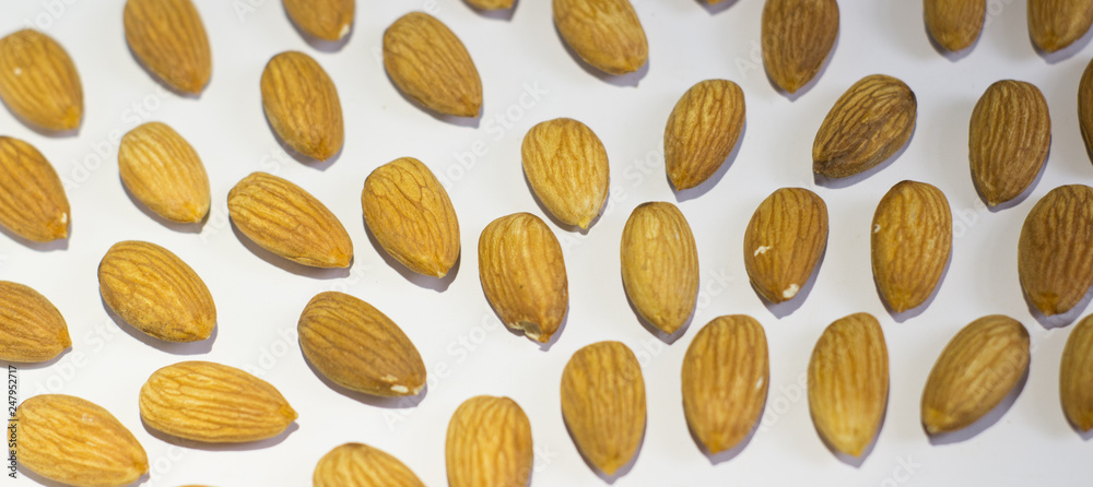 handful of almonds on white background handful of almonds on white background