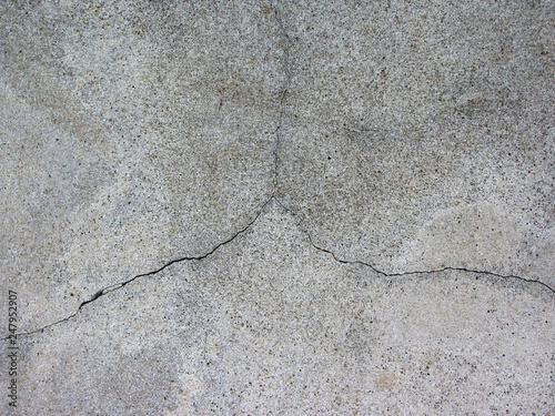 Plastered cement wall with cracks