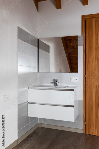 Sink detail with tiles and mirror