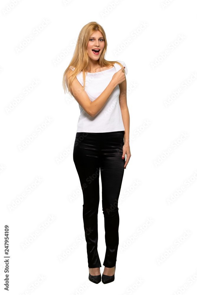Young blonde woman pointing finger to the side and presenting a product over isolated white background Young blonde woman pointing finger to the side and presenting a product over isolated white background