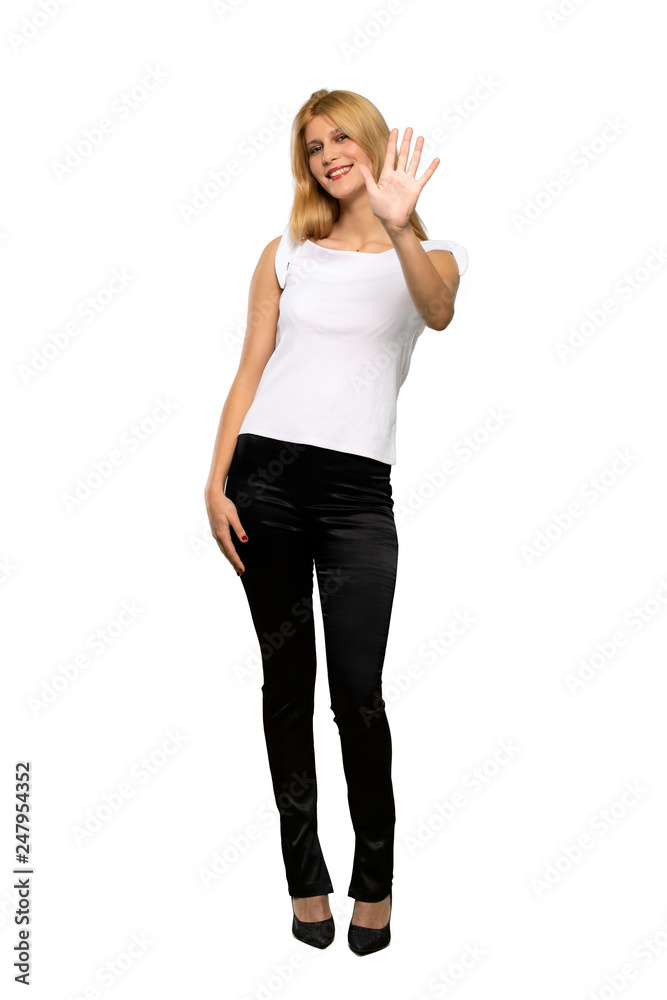 Young blonde woman counting five with fingers over isolated white background Young blonde woman counting five with fingers over isolated white background
