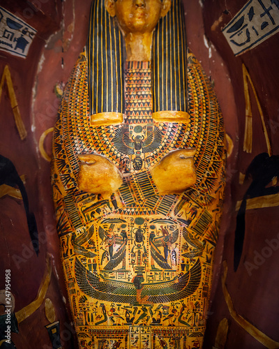 Obraz na plátně Cairo Egypt December 5, 2018: Color drawings based on the mythology of ancient on Egypt sarcophagus inside another sarcophagus 1000 B
