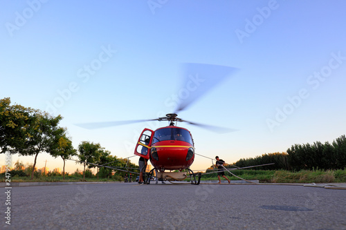 Agricultural helicopters are loading fuel and pesticides on highways, Luannan County, Hebei Province, China