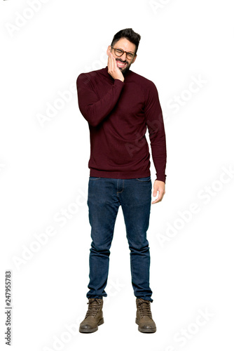 Full-length shot of Handsome man with glasses with toothache on isolated white background