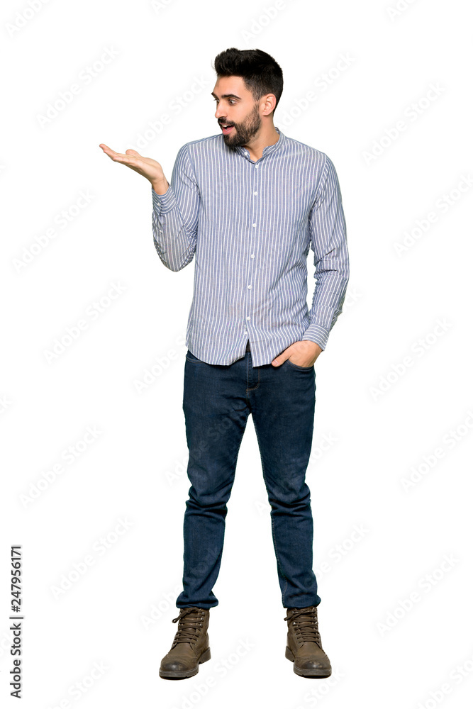 Full-length shot of Elegant man with shirt holding copyspace imaginary on the palm to insert an ad on isolated white background Full-length shot of Elegant man with shirt holding copyspace imaginary on the palm to insert an ad on isolated white background