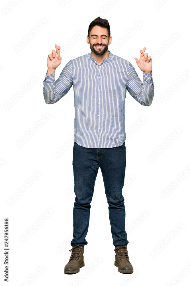 Full-length shot of Elegant man with shirt with fingers crossing and wishing the best on isolated white background Full-length shot of Elegant man with shirt with fingers crossing and wishing the best on isolated white background