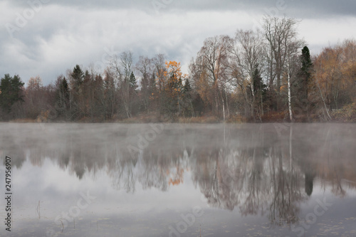 Beautiful autumn landscape of Kymijoki river waters in fog. Finland, Kymenlaakso, Kouvola.