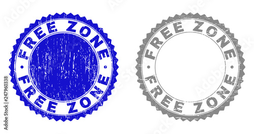 Grunge FREE ZONE stamp seals isolated on a white background. Rosette seals with grunge texture in blue and grey colors. Vector rubber stamp imprint of FREE ZONE label inside round rosette.