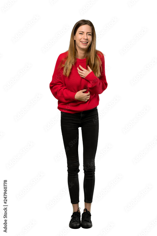 A full-length shot of a Young woman with red sweater smiling a lot over isolated white background A full-length shot of a Young woman with red sweater smiling a lot over isolated white background
