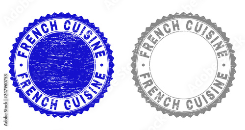 Grunge FRENCH CUISINE stamps isolated on a white background. Rosette seals with grunge texture in blue and grey colors. Vector rubber stamp imitation of FRENCH CUISINE caption inside round rosette.