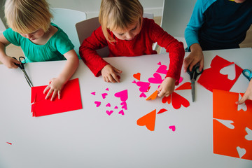 kids making hearts from paper, prepare for valentine day