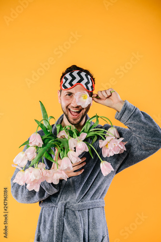 bouquet of tulips in hand on white background close-up. Concept 8 March, international women's day. Valentine's Day. Smart young man at Valentine's day. Concepts. Love - Image