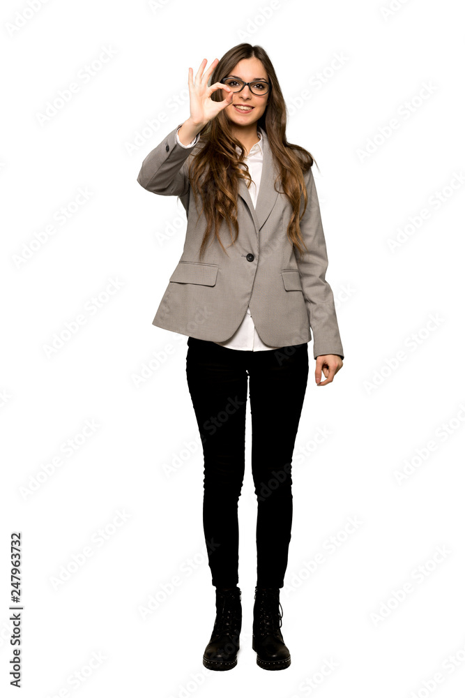 Full-length shot of Business woman showing an ok sign with fingers on isolated white background Full-length shot of Business woman showing an ok sign with fingers on isolated white background