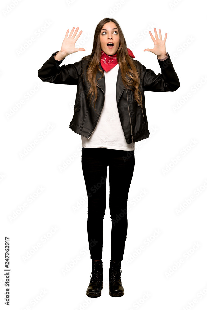 Full-length shot of Young woman with leather jacket counting ten with fingers on isolated white background Full-length shot of Young woman with leather jacket counting ten with fingers on isolated white background