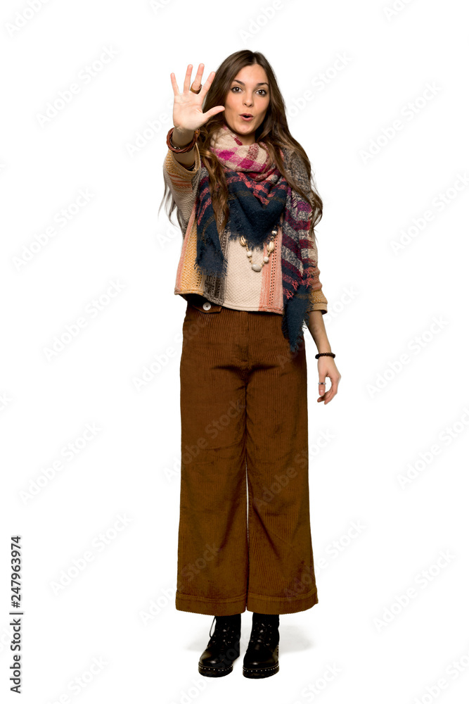 Full-length shot of Young hippie woman counting five with fingers on isolated white background Full-length shot of Young hippie woman counting five with fingers on isolated white background