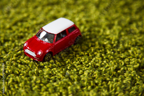 car on a green grassy background
