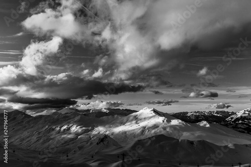 Epic mountains in black and white with some clouds in the evening sun at Davos Switzerland 