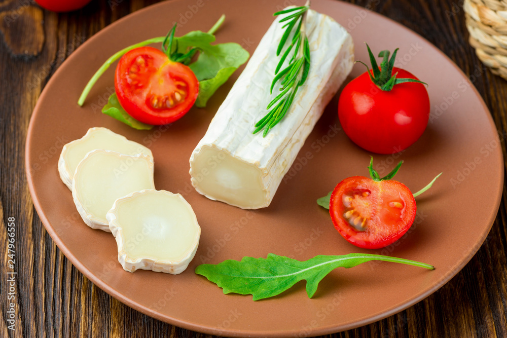 Graviera greek cheese on clay plate.