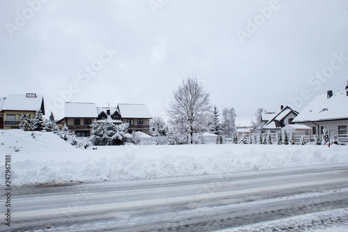 Fabulously beautiful snow-covered houses, streets and roads in the snow, winter snowfall, snow drifts