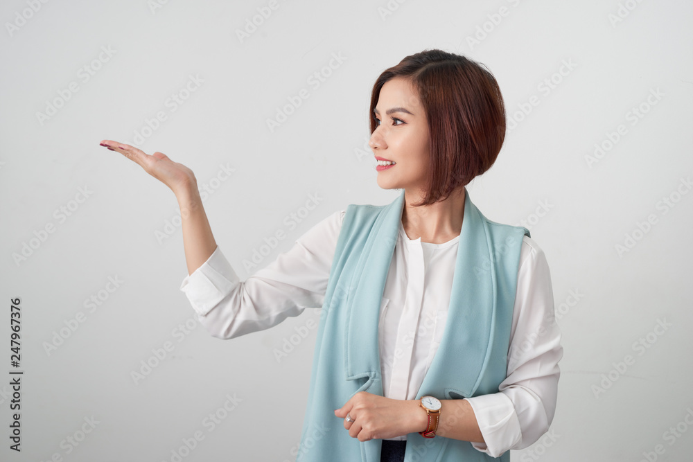 Business Woman presenting Product on her hand Isolated On White Background. Business Woman presenting Product on her hand Isolated On White Background.