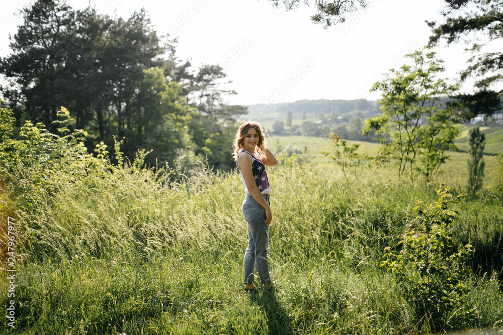 A girl in a hat on a walk in the park