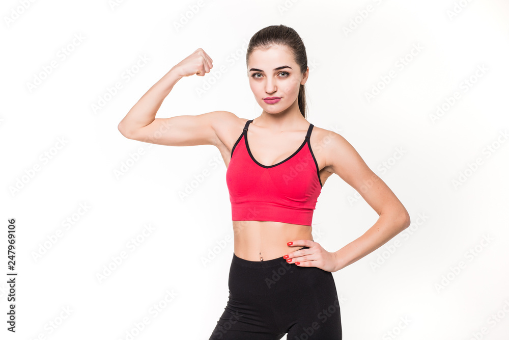 Portrait of a beautiful fitness woman showing her biceps isolated on a white background Portrait of a beautiful fitness woman showing her biceps isolated on a white background