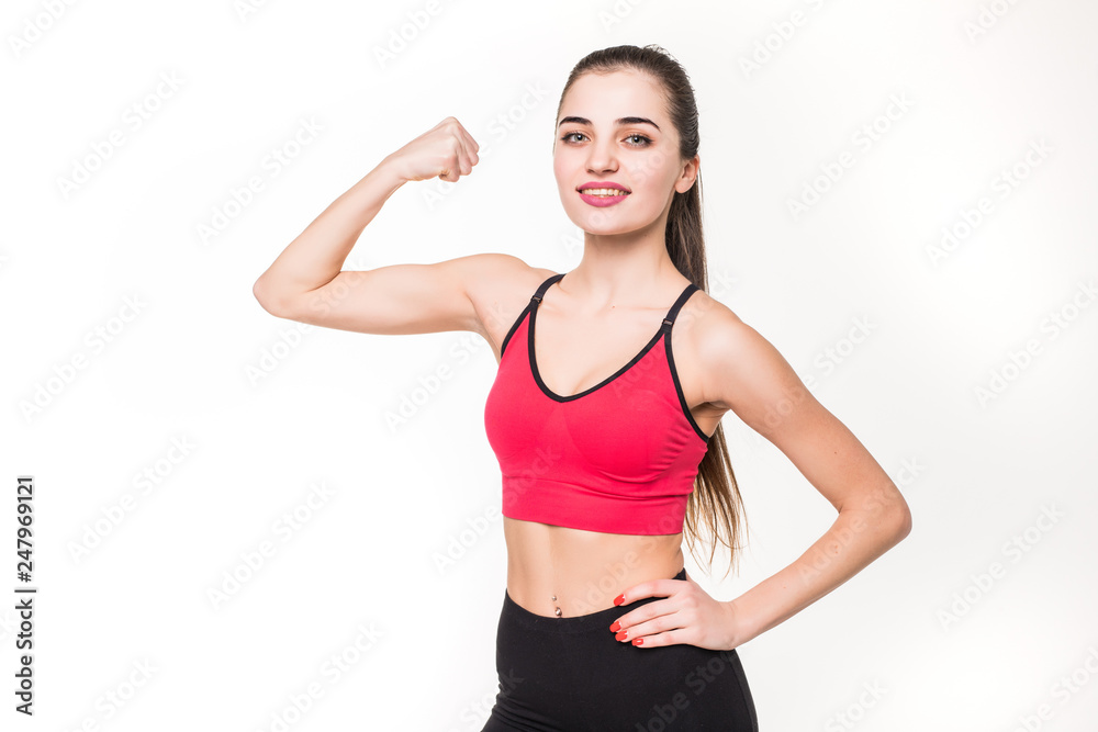 Portrait of a beautiful fitness woman showing her biceps isolated on a white background Portrait of a beautiful fitness woman showing her biceps isolated on a white background