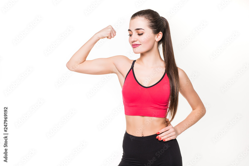 Portrait of a beautiful fitness woman showing her biceps isolated on a white background Portrait of a beautiful fitness woman showing her biceps isolated on a white background