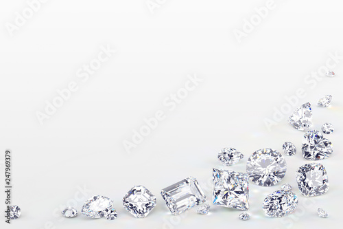 Variously cut diamonds scattered along the image corner on white background photo