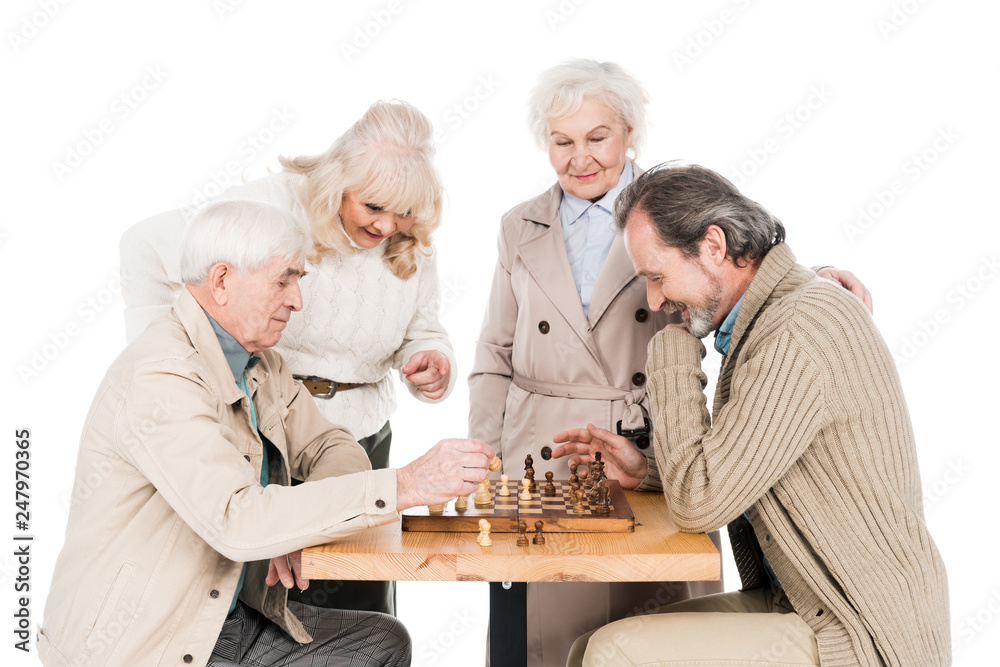 retired friends playing chess near senior women isolated on white retired friends playing chess near senior women isolated on white